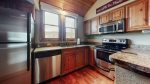 Fully equipped kitchen featuring granite counter tops